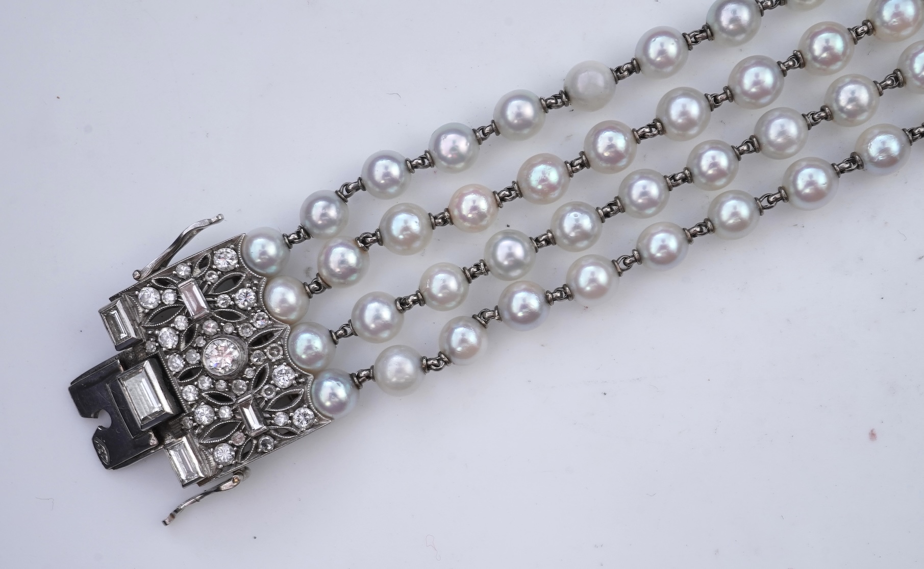A cultured pearl and diamond bracelet